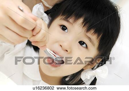 Girl eating a meal View Large Photo Image Stock Image - Girl eating a meal. Fotosearch