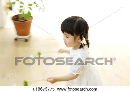 Stock Photography - Girl having flower. Fotosearch