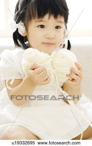 Stock Photography - Girl having woolen yarn. Fotosearch