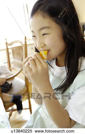 Stock Photography - Girl who eats breakfast. Fotosearch