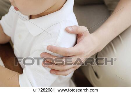 Hand touching boy's shoulder View Large Photo Image Stock Image - Hand touching boy's shoulder. Fotosearch