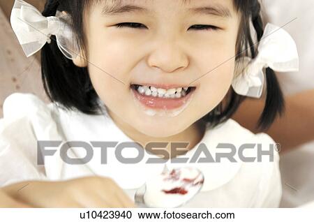 Stock Image - Smiling girl. Fotosearch