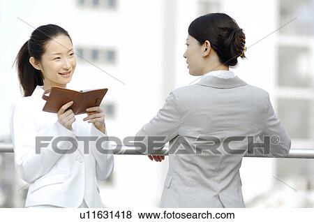 Business ladies who rests at the rooftop View Large Photo Image Stock Photo - Business ladies who rests at the rooftop. Fotosearch