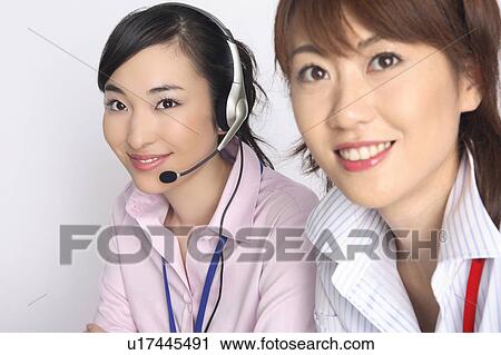 Business lady talking in headset View Large Photo Image Stock Image - Business lady talking in headset. Fotosearch