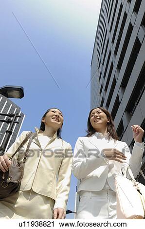 Business lady who walks in the business district View Large Photo Image Stock Image - Business lady who walks in the business district. Fotosearch