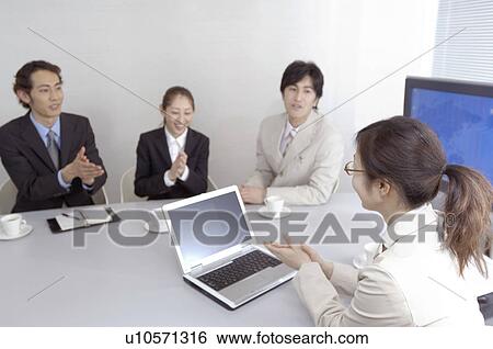 Stock Photograph - Office workers during conference. Fotosearch