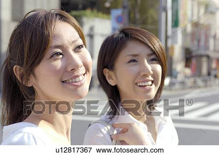 Stock Photo - Smiling women. Fotosearch