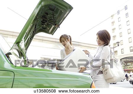 Taxi and women View Large Photo Image Stock Photo - Taxi and women. Fotosearch