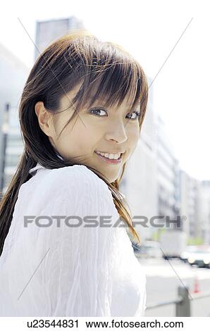 Woman at the street corner View Large Photo Image Stock Image - Woman at the street corner. Fotosearch