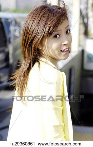 Woman at the street corner View Large Photo Image Stock Image - Woman at the street corner. Fotosearch