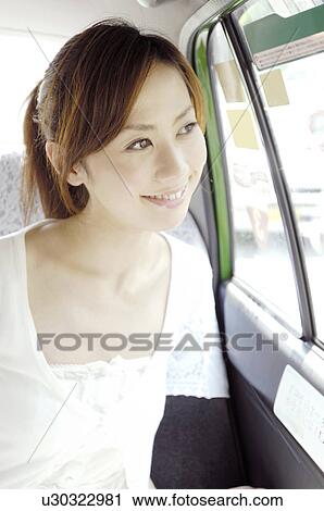Woman in the taxi View Large Photo Image Stock Image - Woman in the taxi. Fotosearch