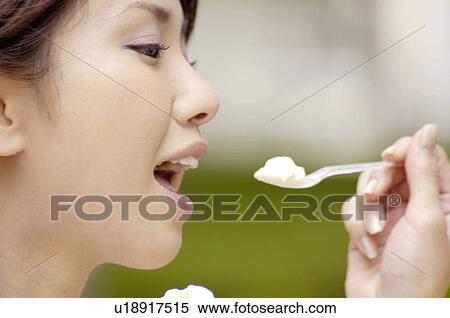 Woman who eats ice View Large Photo Image Stock Photography - Woman who eats ice. Fotosearch