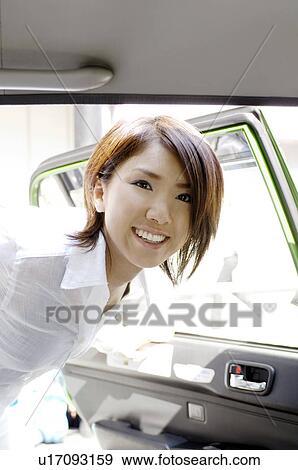 Stock Photo - Woman who takes a taxi. Fotosearch