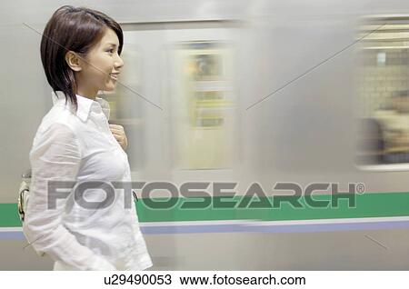 Woman who waits for train View Large Photo Image Stock Image - Woman who waits for train. Fotosearch