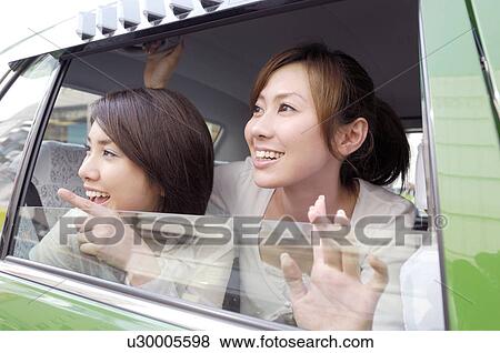 Women who takes a taxi View Large Photo Image Stock Photo - Women who takes a taxi. Fotosearch
