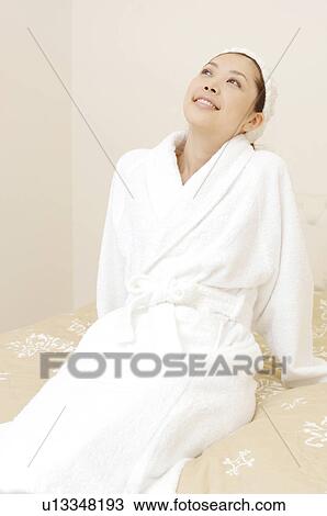 Stock Image - Woman after taking a bath. Fotosearch
