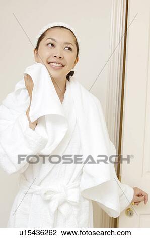 Stock Image - Woman after taking a bath. Fotosearch
