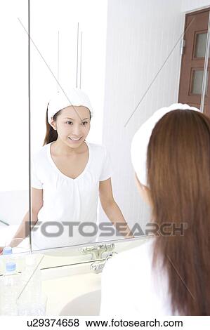 Woman in the powder room View Large Photo Image Stock Photo - Woman in the powder room. Fotosearch