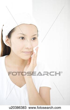 Woman making up her face View Large Photo Image Stock Image - Woman making up her face. Fotosearch