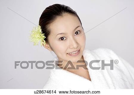 Woman wearing a bathrobe View Large Photo Image Picture - Woman wearing a bathrobe. Fotosearch