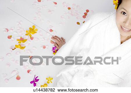 Stock Image - Woman wearing a bathrobe. Fotosearch