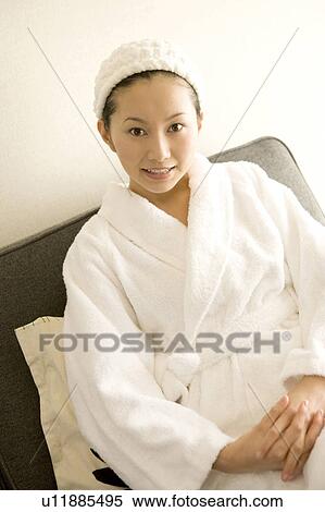 Stock Photography - Woman wearing a bathrobe. Fotosearch