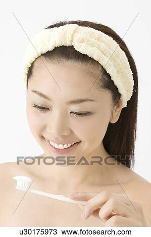 Woman who brushes her teeth View Large Photo Image Stock Image - Woman who brushes her teeth. Fotosearch