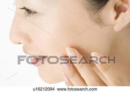 Picture - Woman who does skin care. Fotosearch
