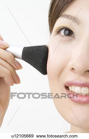 Stock Photo - Woman who makes up. Fotosearch