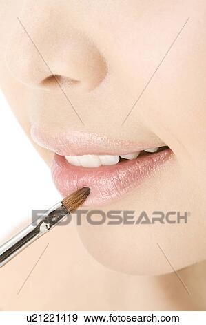 Stock Photo - Woman who paints with lipstick. Fotosearch