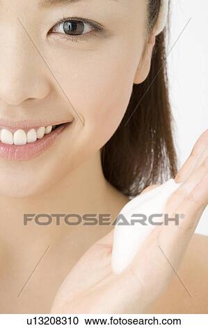 Woman who washes her face View Large Photo Image Stock Image - Woman who washes her face. Fotosearch
