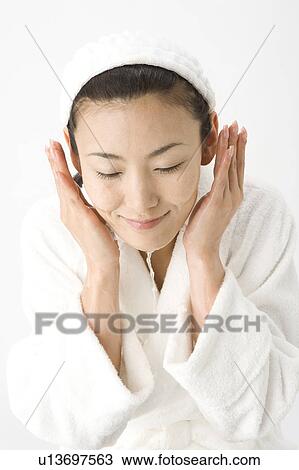 Woman who washes her face View Large Photo Image Stock Image - Woman who washes her face. Fotosearch