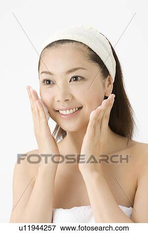 Stock Photo - Woman who washes her face. Fotosearch