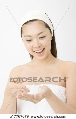 Woman who washes her face View Large Photo Image Stock Photo - Woman who washes her face. Fotosearch