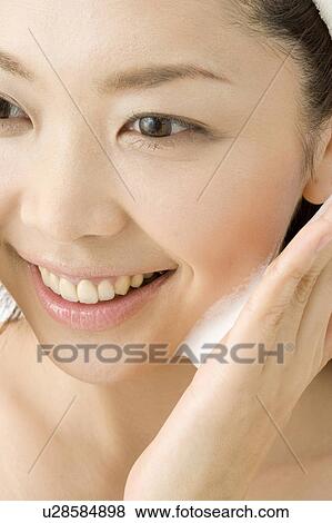 Woman who washes her face View Large Photo Image Stock Photo - Woman who washes her face. Fotosearch