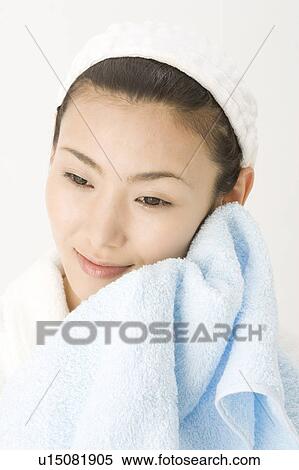 Woman who wipes a face View Large Photo Image Stock Photography - Woman who wipes a face. Fotosearch