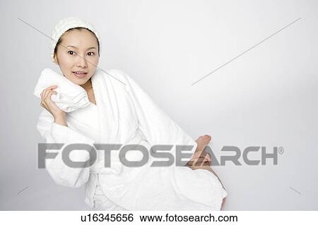 Woman wiping sweat View Large Photo Image Stock Photograph - Woman wiping sweat. Fotosearch
