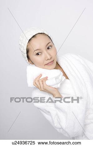 Woman wiping sweat View Large Photo Image Stock Photography - Woman wiping sweat. Fotosearch