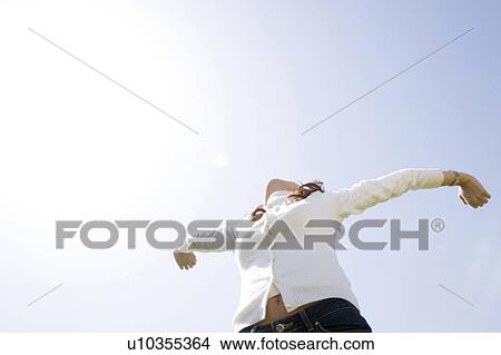 Picture - Sky and woman. Fotosearch