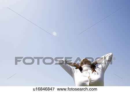 Stock Photo - Sky and woman. Fotosearch