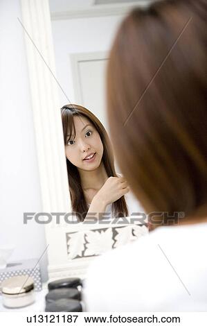 Woman before the dresser View Large Photo Image Stock Photo - Woman before the dresser. Fotosearch