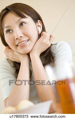 Woman resting her chin in her hands View Large Photo Image Stock Image - Woman resting her chin in her hands. Fotosearch