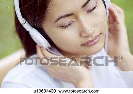 Woman who hangs upon the music View Large Photo Image Stock Image - Woman who hangs upon the music. Fotosearch