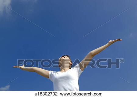 Stock Image - Woman who spreads both hands. Fotosearch