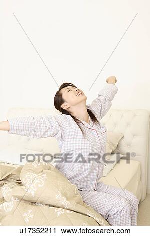Stock Image - Woman who stretches herself. Fotosearch