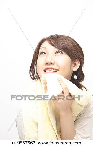 Woman wipeing sweat View Large Photo Image Stock Photo - Woman wipeing sweat. Fotosearch
