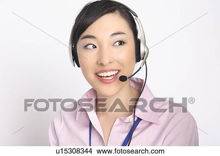Business lady talking in headset View Large Photo Image Picture - Business lady talking in headset. Fotosearch