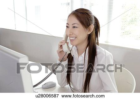 Business lady who is on the phone View Large Photo Image Stock Photo - Business lady who is on the phone. Fotosearch