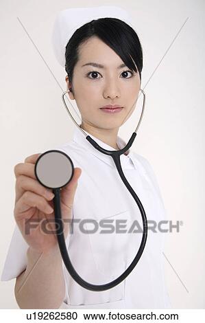 Stock Image - Nurse having a stethoscope. Fotosearch
