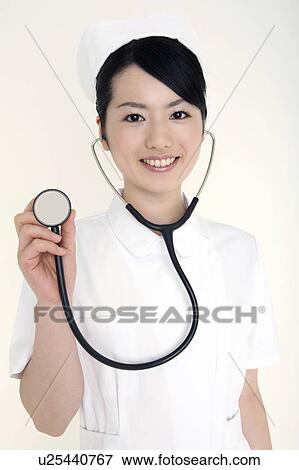 Nurse having a stethoscope View Large Photo Image Stock Photo - Nurse having a stethoscope. Fotosearch